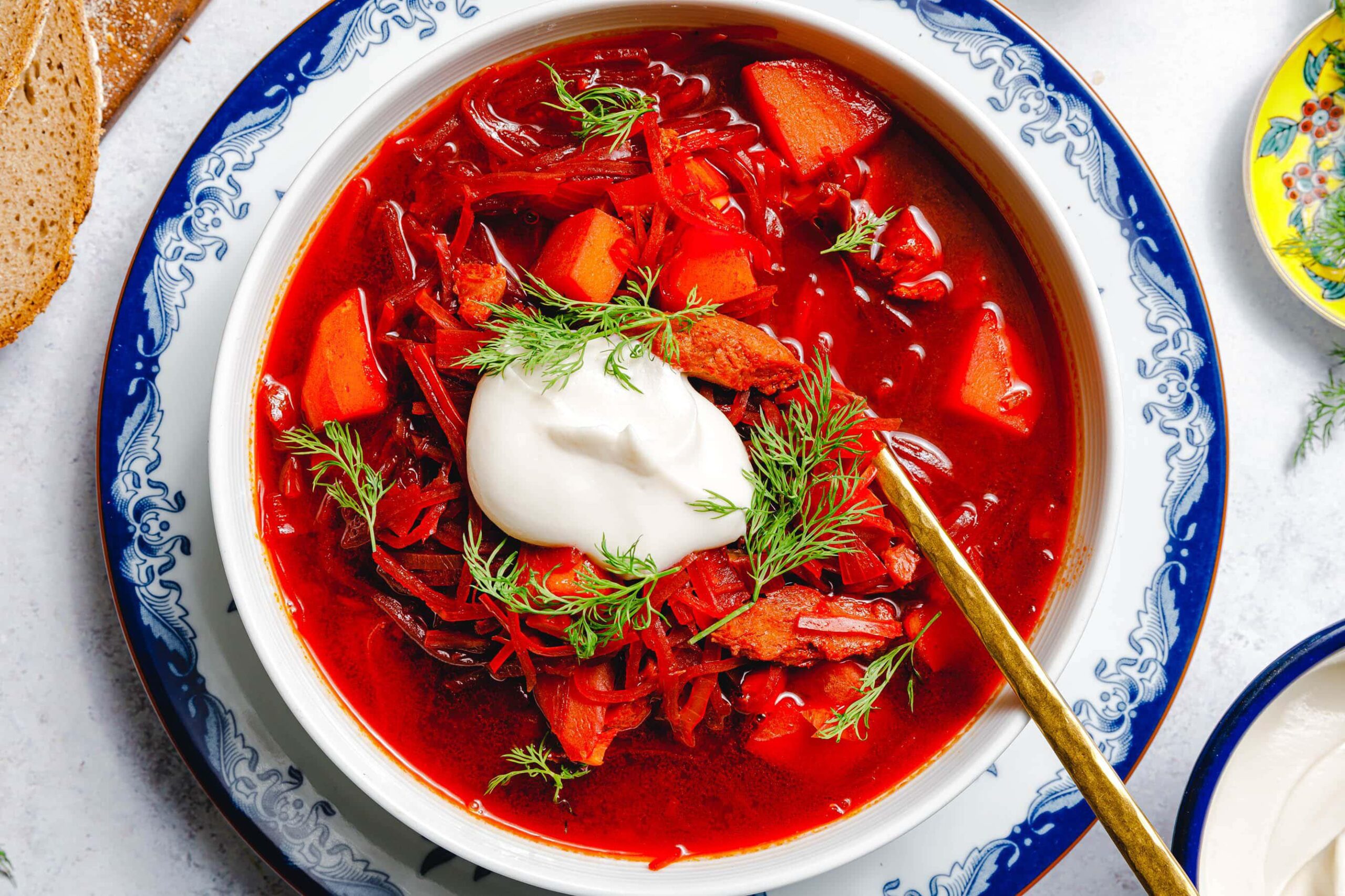 Classic Borscht soup — vibrant red beet soup with sour cream and dill at Perfect Together Philadelphia